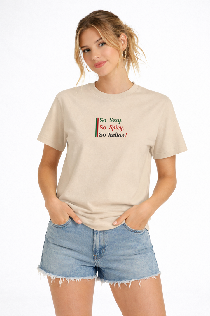 Woman wearing a beige t-shirt with text and denim shorts on a white background