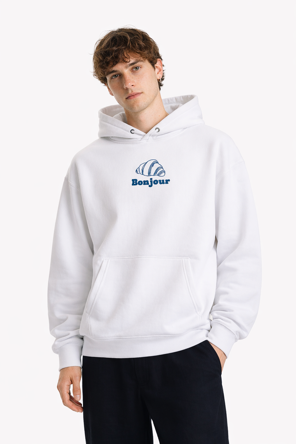 Person wearing a white hoodie with a blue logo and 'Bonjour' text on a white background