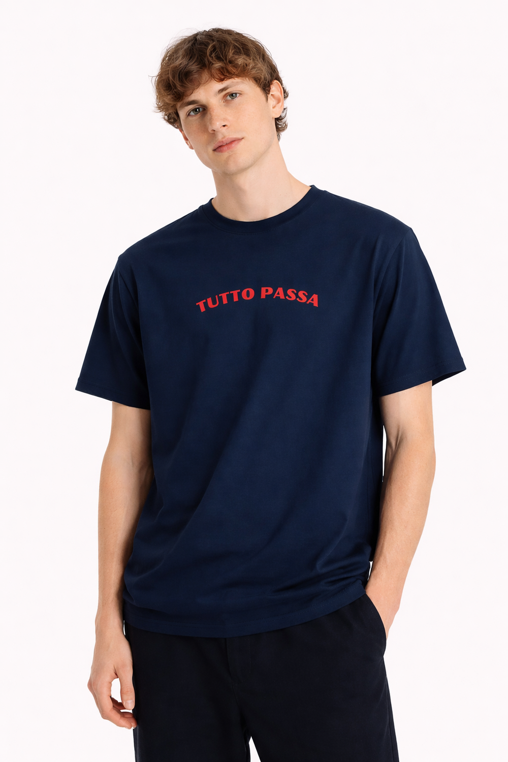 Person wearing a navy blue t-shirt with 'TUTTO PASSA' text on a white background