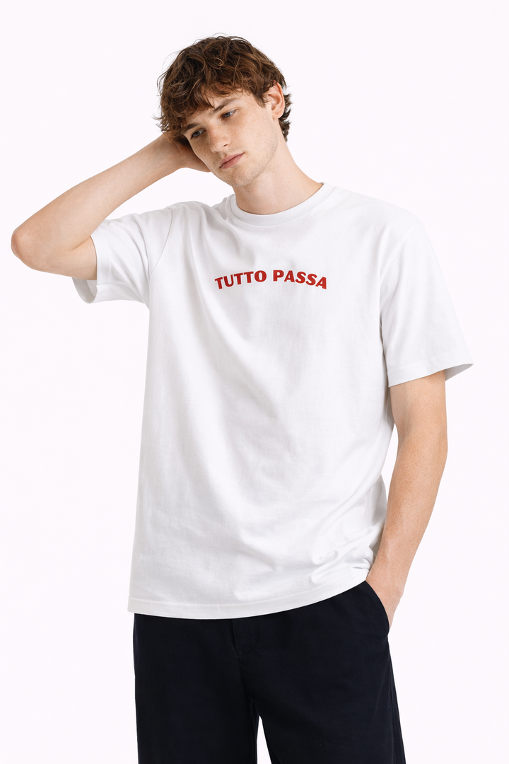Person wearing a white t-shirt with red text on a white background
