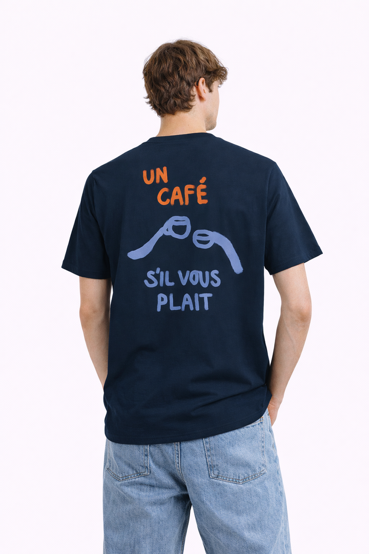 Person wearing a navy blue t-shirt with text and graphics on the back, standing against a white background.