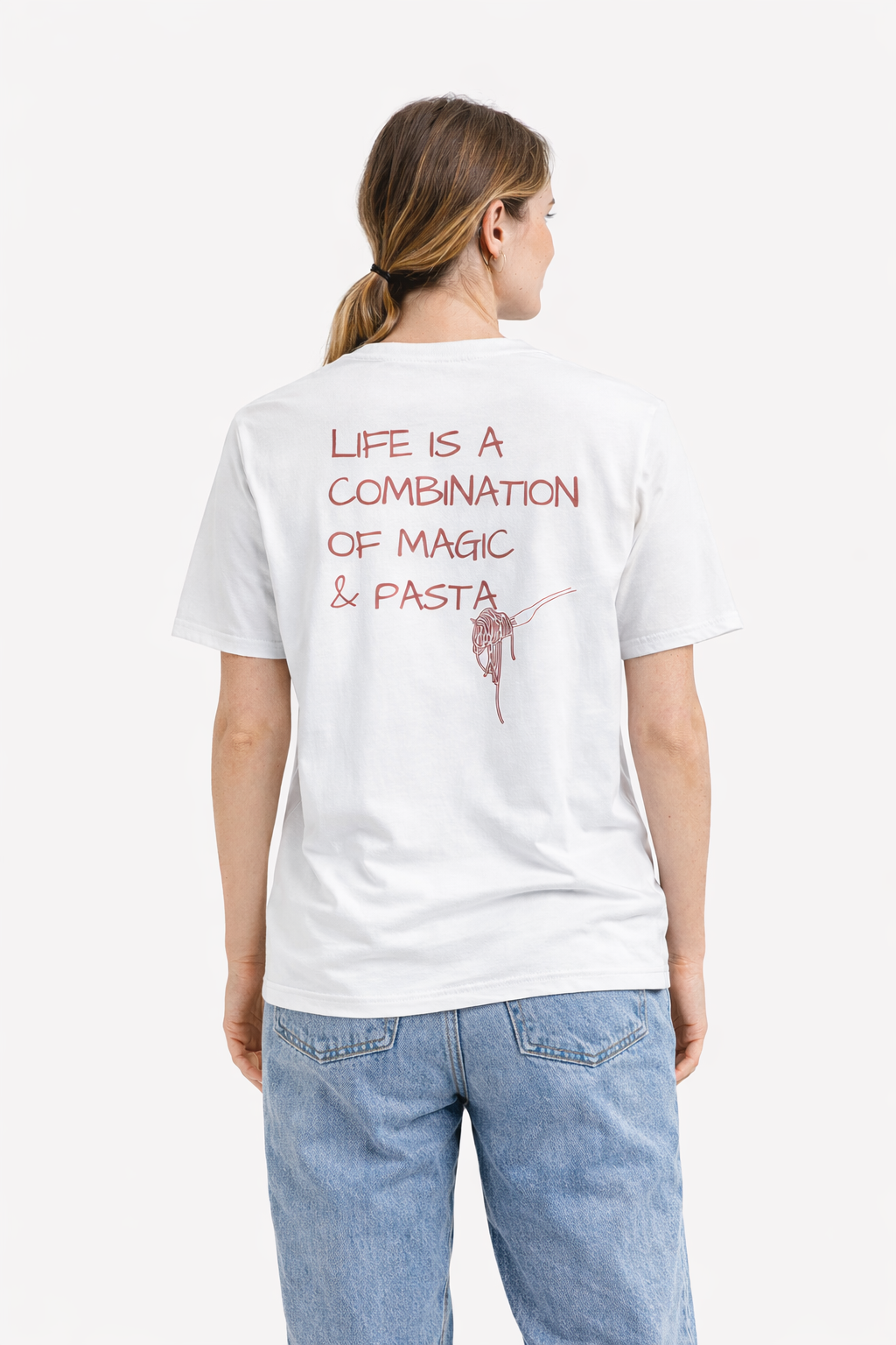 Person wearing a white t-shirt with text on the back, standing against a white background