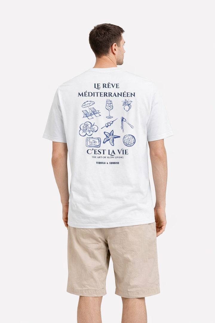 Man wearing a white t-shirt with a graphic design on the back, standing against a white background