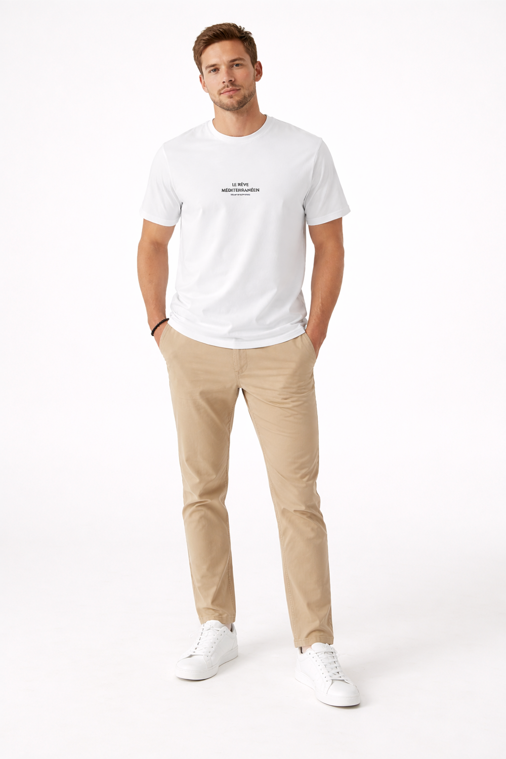 Man wearing a white t-shirt and beige pants on a white background
