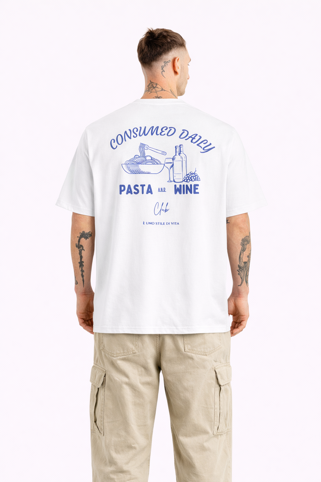 Person wearing a white t-shirt with text and graphics on the back, standing against a white background.