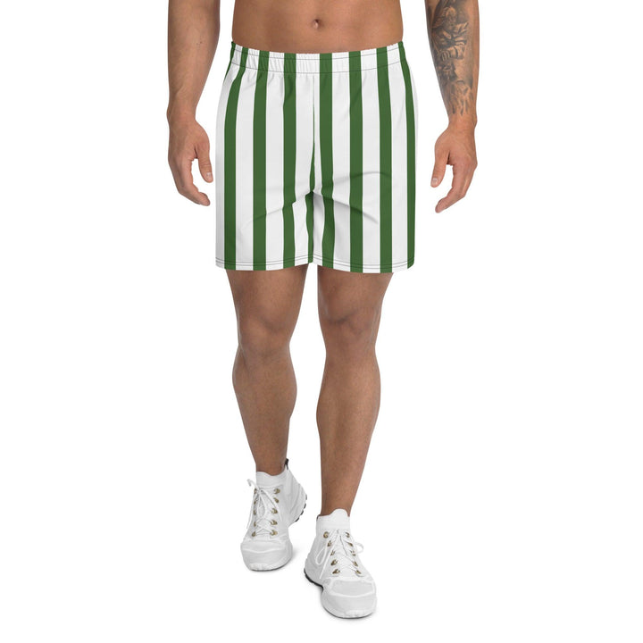 Model wearing men's green athletic shorts, paired with simple white sneakers, highlighting the breathable fabric and relaxed fit.