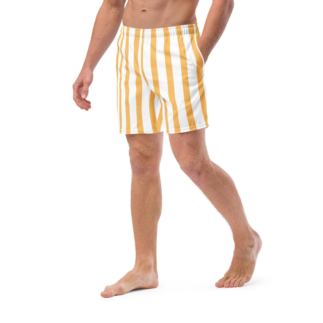 Model wearing yellow and white striped eco friendly swim trunks by Tequila & Sunrise.