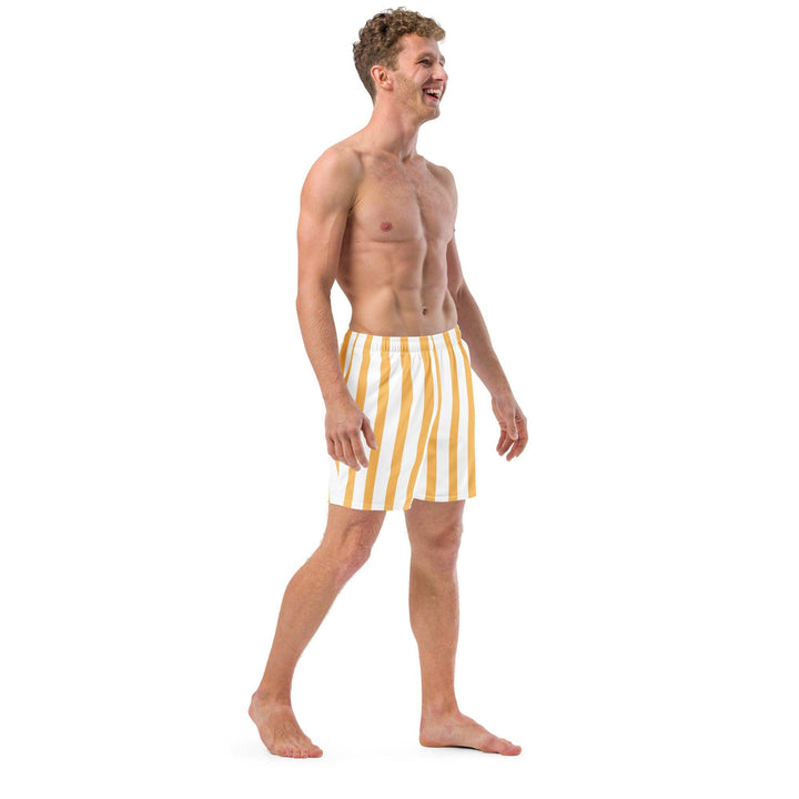 Laughing model wearing yellow and white striped swim trunks, eco friendly, by Tequila & Sunrise.