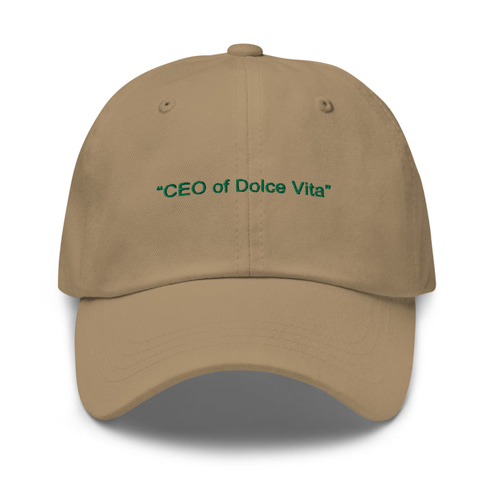 The CEO of Dolce Vita Hat by Tequila & Sunrise is a khaki baseball cap with green embroidered text that reads "CEO of Dolce Vita." It features an adjustable strap for a comfortable fit and offers a low-profile Dad hat style that adds relaxed sophistication to any outfit.