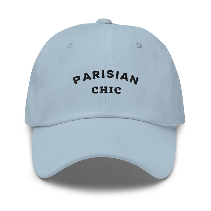 The Parisian Chic Dad Hat by Tequila & Sunrise is a light blue accessory made from chino cotton twill, adorned with PARISIAN CHIC embroidered in black on the front and equipped with an adjustable strap for the perfect fit.