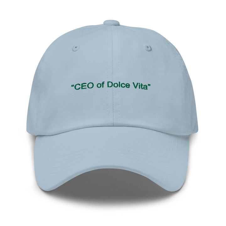 Introducing The CEO of Dolce Vita Hat by Tequila & Sunrise—a sleek, low-profile baseball cap in light blue that features the phrase "CEO of Dolce Vita" embroidered on the front in green, and comes with an adjustable strap for a perfect fit.