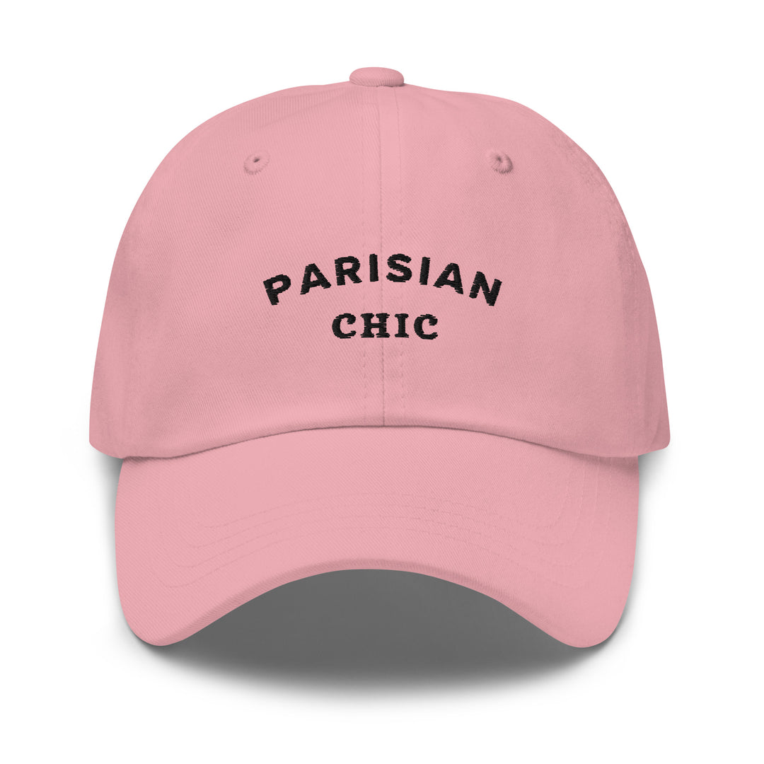 The Parisian Chic Dad Hat by Tequila & Sunrise is a pink chino cotton twill hat with "Parisian Chic" embroidered in black on the front, offering an adjustable strap for a perfect fit.