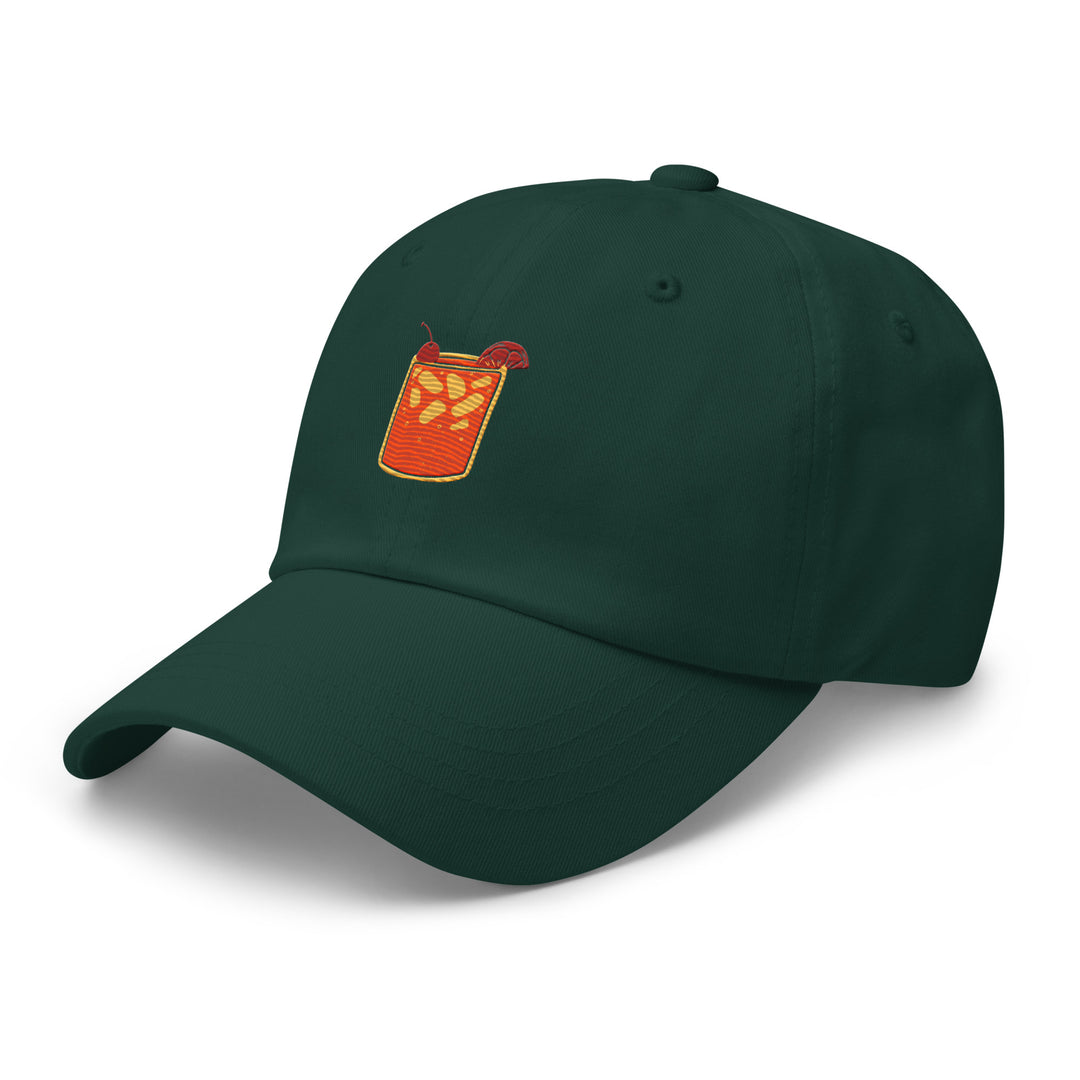 The Tequila & Sunrise Glass Hat by Tequila & Sunrise is a sleek, green baseball cap that showcases an embroidered cocktail glass with ice cubes and an orange slice on the front. It includes an adjustable strap to ensure the perfect fit for anyone who appreciates chic dad hats.