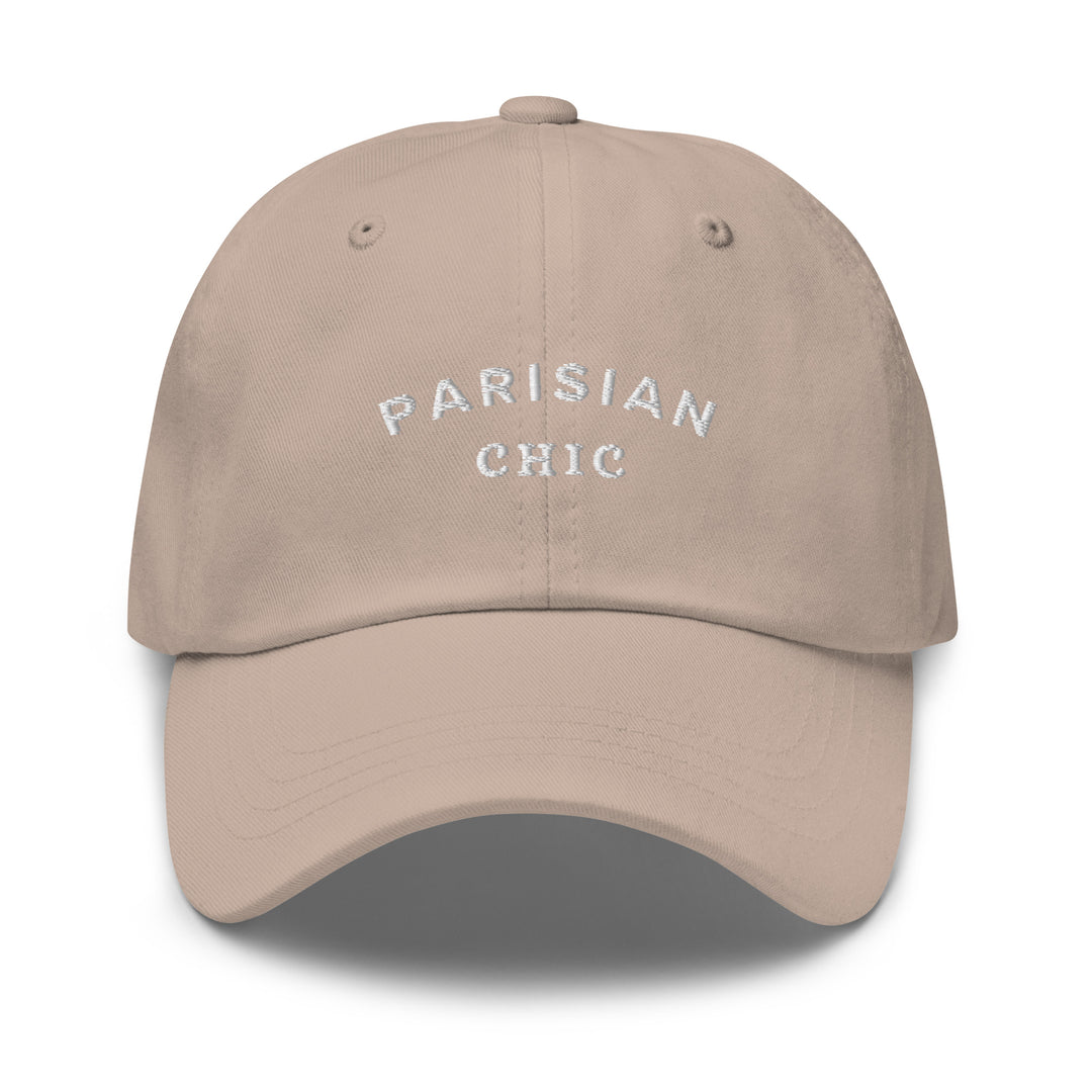 Introducing The Parisian Chic Dad Hat by Tequila & Sunrise: a stylish beige hat made from chino cotton twill, adorned with white embroidered lettering that reads "PARISIAN CHIC" on the front. It also features an adjustable strap to ensure the perfect fit.