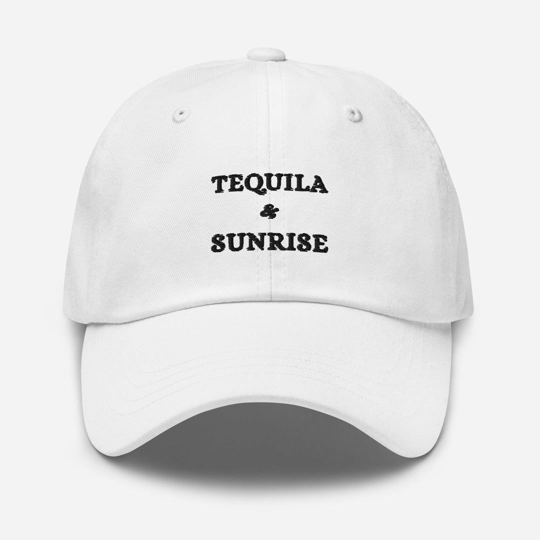 Introducing The Tequila & Sunrise Hat by Tequila & Sunrise, a fashionable white dad hat adorned with the iconic logo embroidered in black on the front, and designed with an adjustable strap to ensure a perfect fit.