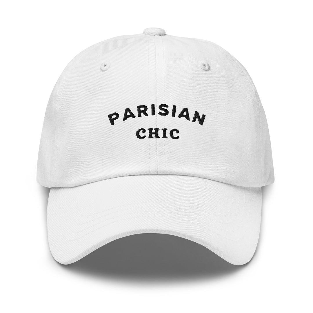 A white baseball cap from Tequila & Sunrise called The Parisian Chic Dad Hat is made from chino cotton twill. It features the text "PARISIAN CHIC" embroidered in black on the front and includes an adjustable strap for a perfect fit.