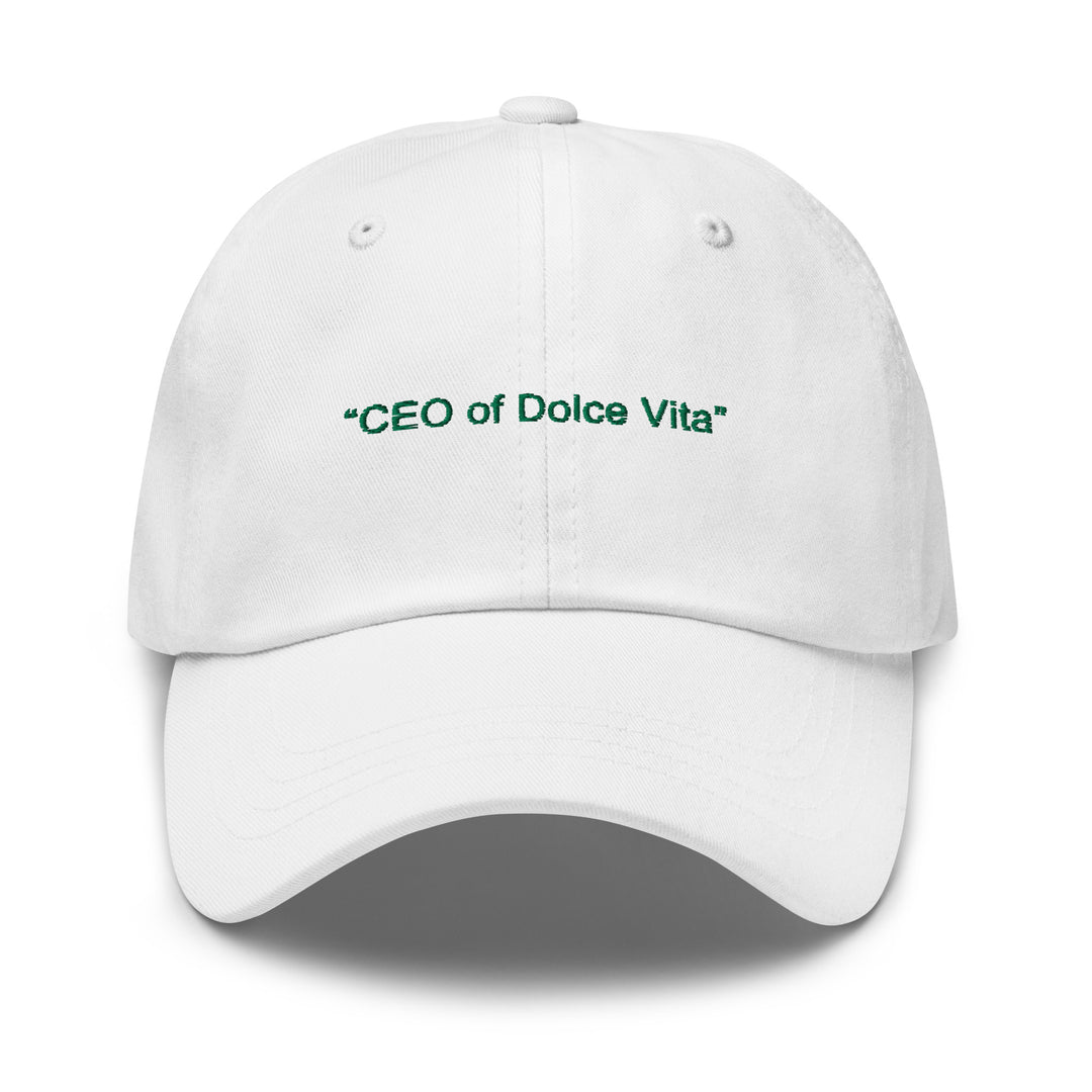 The Tequila & Sunrise "CEO of Dolce Vita" Hat is a low-profile, white Dad hat featuring green text on the front. It includes an adjustable strap for a comfortable fit.