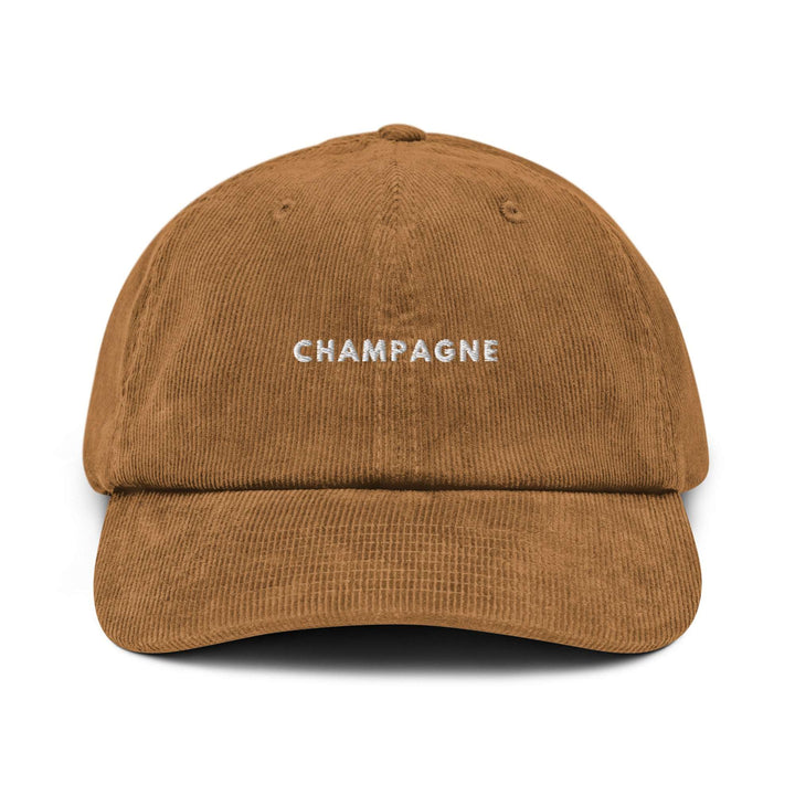 Tequila & Sunrise presents The Champagne Corduroy hat, a brown cotton corduroy baseball cap with "CHAMPAGNE" embroidered in white on the front and an adjustable buckle for a perfect fit.