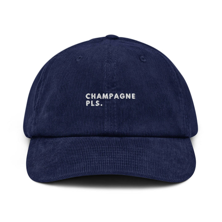 The Champagne Please Corduroy Hat by Tequila & Sunrise is a navy blue cotton cap with an adjustable buckle, featuring white embroidered text that says CHAMPAGNE PLS.