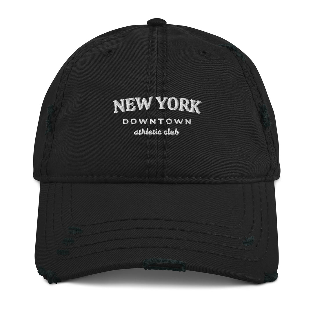 The New York Downtown Athletic Club Hat by Tequila & Sunrise is a black dad hat with "New York Downtown Athletic Club" embroidered in white on the front. Made from pre-shrunk cotton twill, it showcases a stylishly distressed brim for a casual, worn look.