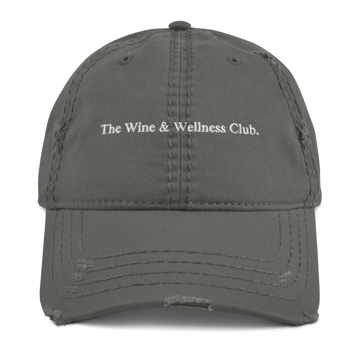 The Wine & Wellness Club by Tequila & Sunrise is a charcoal grey showcasing white text that reads "The Wine & Wellness Club." It features an adjustable strap for a perfect fit.