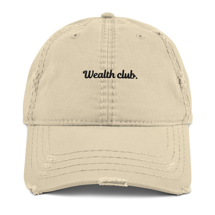 Introducing The Wealth Club Hat by Tequila & Sunrise, a stylish khaki distressed dad hat featuring the word Wealth Club. elegantly embroidered in black on the front. This cap includes subtle distressing on the brim and panels, making it a chic addition to any sophisticated wardrobe.