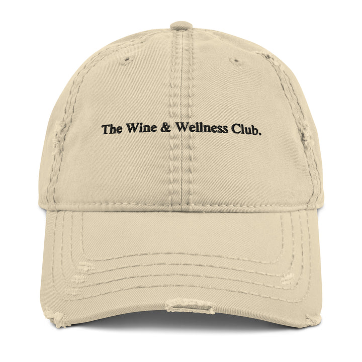 The Wine & Wellness Club by Tequila & Sunrise is a khaki showcasing black text that reads "The Wine & Wellness Club." It features an adjustable strap for a perfect fit.