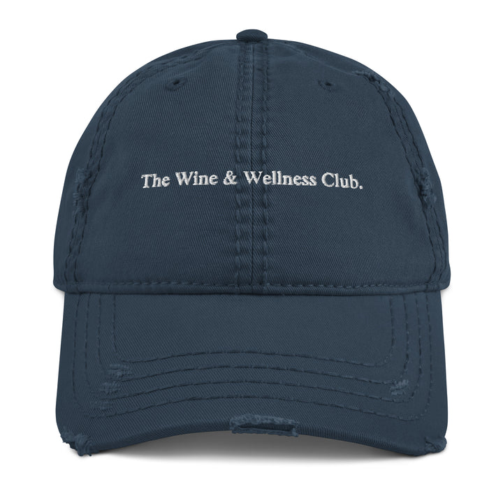 The Wine & Wellness Club by Tequila & Sunrise is a navy distressed dad hat. 