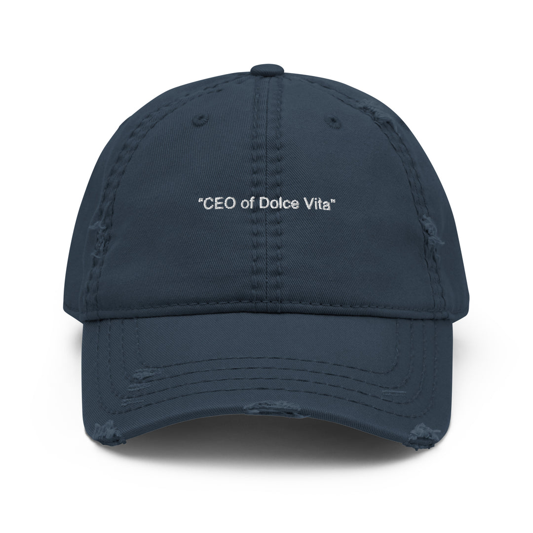 Introducing "The CEO of Dolce Vita Hat" by Tequila & Sunrise, a cotton twill dad hat in dark blue with a distressed finish, featuring the phrase "CEO of Dolce Vita" embroidered on the front.