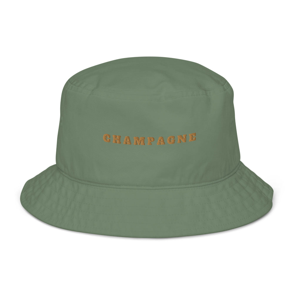 The Champagne Organic Bucket Hat by Tequila & Sunrise is an eco-friendly accessory made from 100% cotton, featuring the word "Champagne" embroidered in vibrant orange.