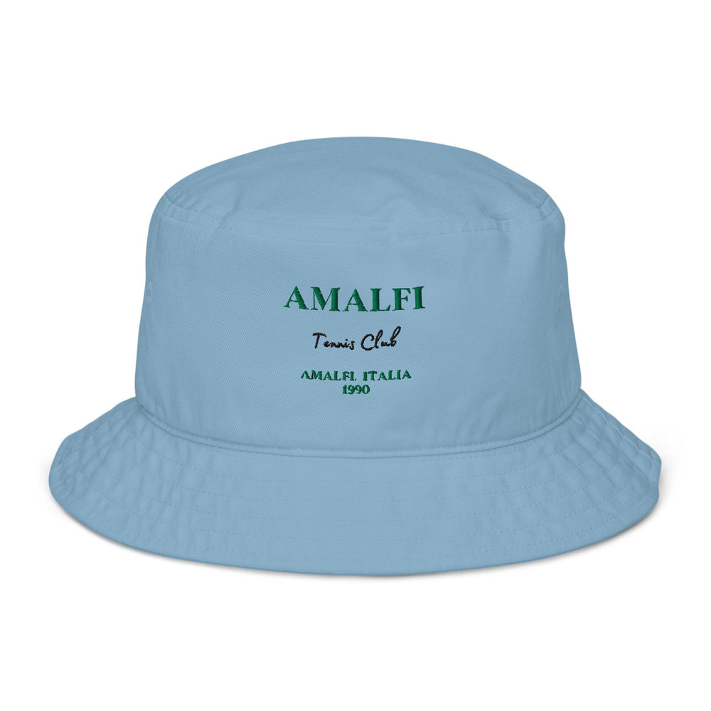 The Amalfi Italia Organic Bucket Hat by Tequila & Sunrise is light blue and features "Amalfi Tennis Club" embroidered in green with "Amalfi Italia 1990" underneath. It's an ideal choice for sun protection while exploring the picturesque Amalfi Coast.