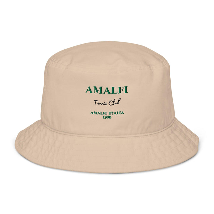 Introducing The Amalfi Italia Organic Bucket Hat by Tequila & Sunrise, featuring a beige design with green text that reads "AMALFI Tennis Club AMALFI ITALIA 1990." It's perfect for sun protection while enjoying the breathtaking views of the Amalfi Coast.