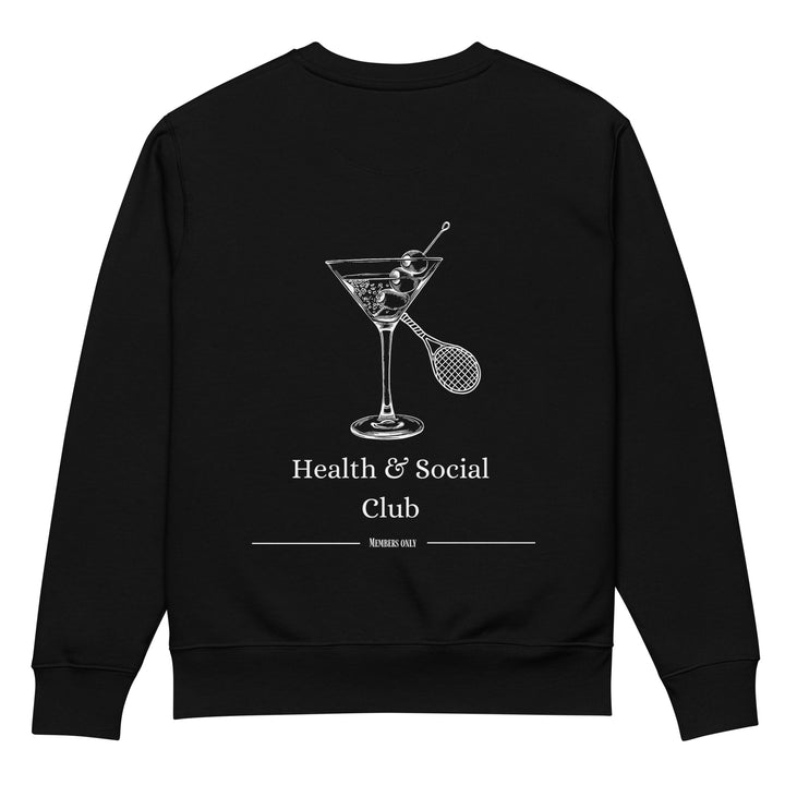 Introducing The Health & Social Club Eco Sweatshirt by Tequila & Sunrise. This made-to-order, durable, and comfortable black sweatshirt displays a stylish white graphic of a martini glass alongside a tennis racket and ball. Below the image, you'll find the phrases "Health & Social Club" and "Members Only." Crafted from organic cotton, it's perfect for those who appreciate an exclusive style.