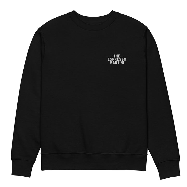 Introducing The Espresso Martini Eco Sweatshirt by Tequila & Sunrise, a black sweatshirt made from organic cotton. This minimalist design features "The Espresso Martini" in white text on the upper left chest, offering a stylish and sustainable choice for your wardrobe.