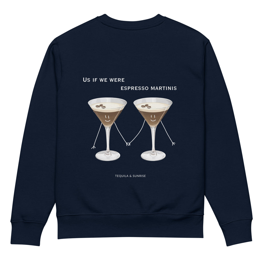 The Tequila & Sunrise If We Were Espresso Martinis Eco Sweatshirt, in navy, is made from durable organic cotton and showcases two cartoon espresso martinis with smiling faces and stick figure arms and legs. Above the design is the text "Us if we were ESPRESSO MARTINIS," with the brand "Tequila & Sunrise" featured below.