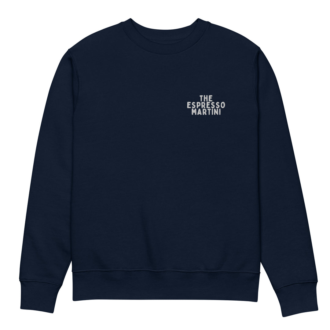 Introducing The If We Were Espresso Martinis Eco Sweatshirt by Tequila & Sunrise. This stylish navy blue sweatshirt is expertly crafted from organic cotton and features "THE ESPRESSO MARTINI" embroidered in white on the upper left chest area. Made to order, it perfectly blends style with sustainability for a durable addition to your wardrobe.