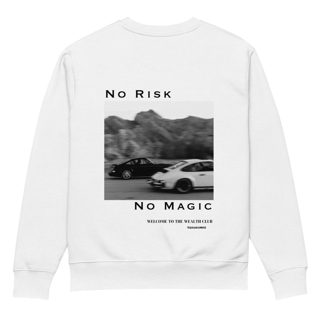 Introducing The No Risk No Magic Eco Sweatshirt by Tequila & Sunrise: a unisex garment crafted from organic cotton, adorned with a striking black-and-white image of two cars racing against a mountain backdrop. The text "No Risk" graces the space above the image and "No Magic" below, ending with an invitation to join the Wealth Club at the bottom. Embrace sustainable fashion with distinctive style.