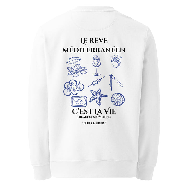 Introducing "The Mediterranean Dream Eco Sweatshirt" by Tequila & Sunrise, a white sweatshirt made from organic cotton. It showcases blue illustrations of Mediterranean icons such as a starfish, seashell, olive branch, lemon slice, and wine glass. Featuring French text alongside English phrases like "The Art of Slow Living" for the mindful lifestyle enthusiast.