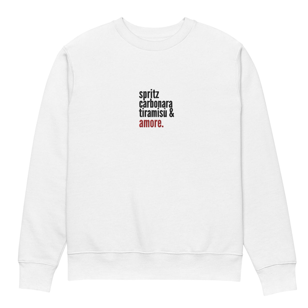 Introducing "The Love from Italy Eco Sweatshirt" by Tequila & Sunrise, a stylish white eco-friendly sweatshirt made from organic cotton. Featuring a modern and clean design, it displays the text "spritz carbonara tiramisu & amore" in black, with the word "amore" highlighted in red for a touch of Italian charm.