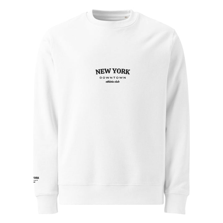 Introducing the Tequila & Sunrise "The New York Downtown Athletic Club Eco Sweatshirt": a minimalist design featuring a crew neck and long sleeves. This durable white sweatshirt is made from organic cotton, with "NEW YORK DOWNTOWN athletic club" printed in black across the front. Displayed beautifully on a plain white background.