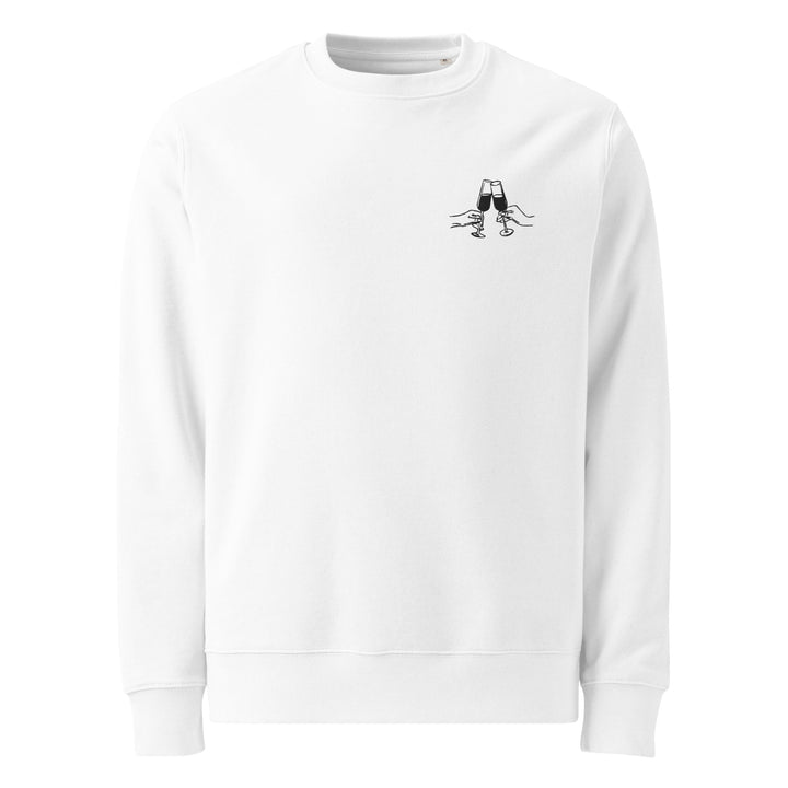 The La Dolce Vita Eco Sweatshirt by Tequila & Sunrise is a white organic cotton sweatshirt, adorned with a small, minimalist embroidery of an upside-down pair of pants with legs and shoes sticking up on the left chest area. It is made on demand for eco-conscious fashion enthusiasts.