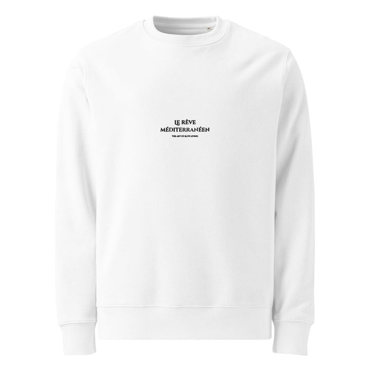 A plain white sweatshirt from Tequila & Sunrise, called The Mediterranean Dream Eco Sweatshirt, crafted from organic cotton and featuring the black text "LE RÊVE MÉDITERRANÉEN" printed in the center.