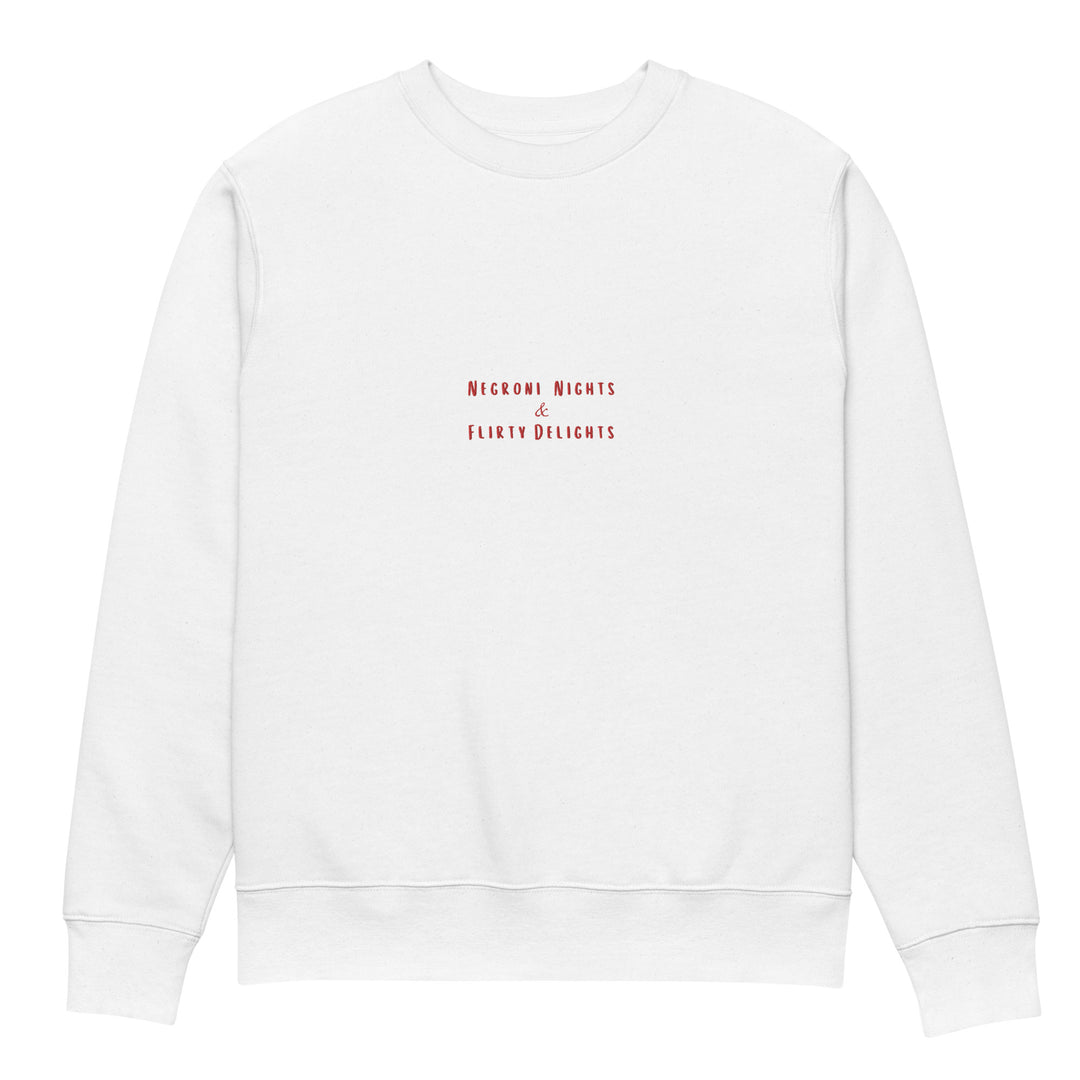 Introducing The Negroni Nights & Flirty Delights Eco Sweatshirt by Tequila & Sunrise, a unisex garment made from organic cotton. It showcases the phrase "Negroni Nights & Flirty Delights" in small red letters at the center, embodying a simple and minimalist design that underscores a dedication to sustainable fashion.