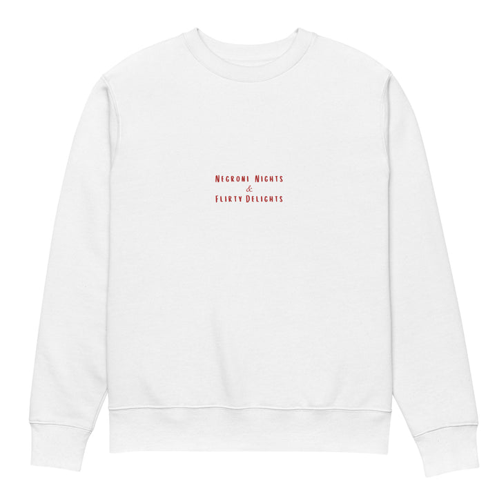 Introducing The Negroni Nights & Flirty Delights Eco Sweatshirt by Tequila & Sunrise, a unisex garment made from organic cotton. It showcases the phrase "Negroni Nights & Flirty Delights" in small red letters at the center, embodying a simple and minimalist design that underscores a dedication to sustainable fashion.