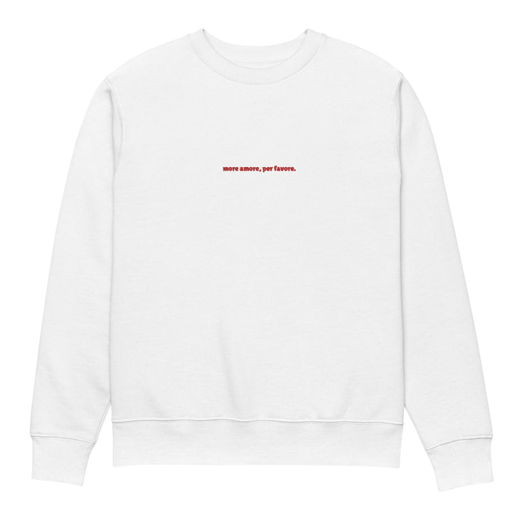 The More Amore Per Favore Eco Sweatshirt by Tequila & Sunrise is a unisex garment made from organic cotton, adorned with the phrase "more amore, per favore" in understated red text centered on the chest. Its minimalist design embodies simplicity and perfectly complements sustainable fashion principles.