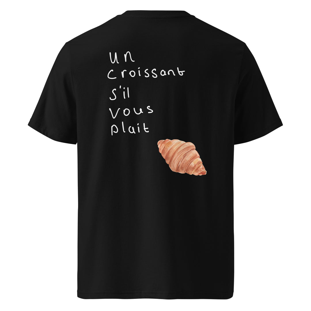 Introducing the Un Croissant S’il Vous Plait Organic T-shirt by Tequila & Sunrise, a unisex black tee showcasing handwritten text "Un croissant s'il vous plaît" alongside a delightful croissant image. Crafted from organic cotton, this eco-friendly shirt is perfect for those who value both style and sustainability.