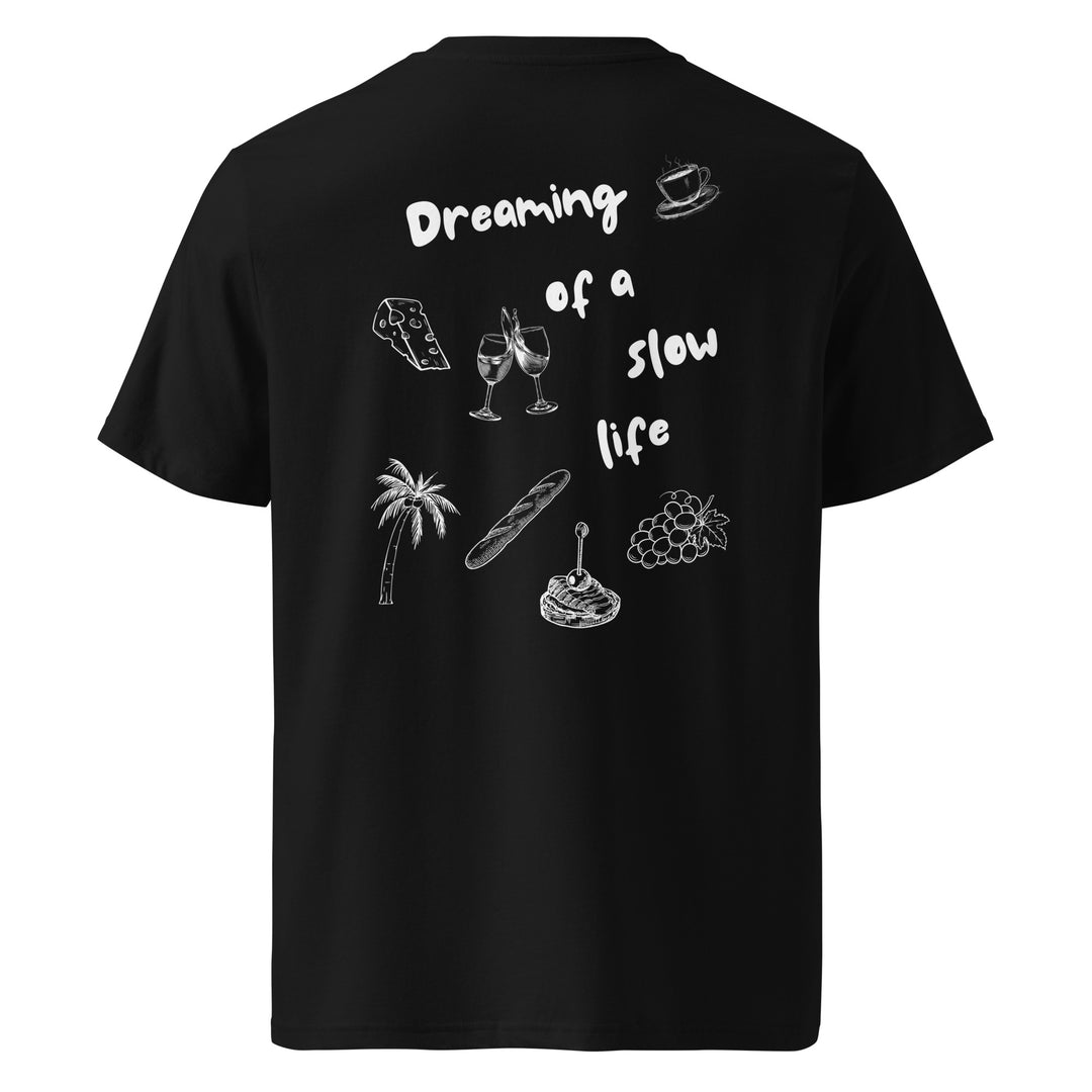 The La Vita Lenta Organic T-shirt by Tequila & Sunrise is a black top made of eco-friendly organic cotton with white text and illustrations that include a coffee cup, gaming controller, wine glasses, palm tree, baguette, grapes, and waffle under the theme "Dreaming of a slow life.