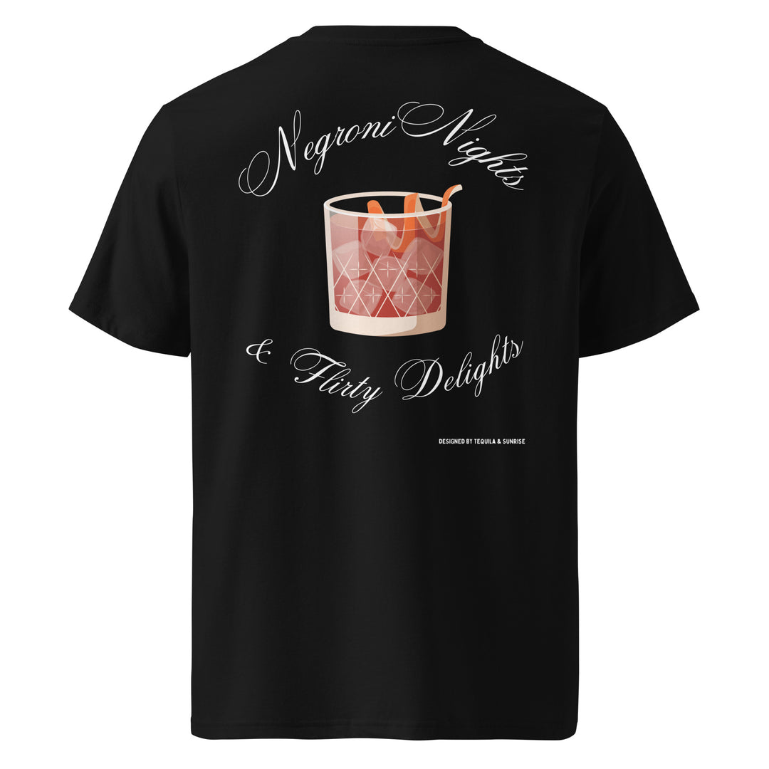 The Negroni Nights & Flirty Delights Organic T-shirt by Tequila & Sunrise is a unisex black tee showcasing a graphic of a Negroni cocktail with the words "Negroni Nights & Flirty Delights." Made from organic cotton, this environmentally conscious piece is ideal for fashion-savvy cocktail lovers.