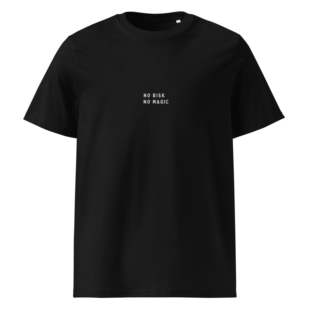 The No Risk No Magic Organic T-shirt by Tequila & Sunrise is a unisex black shirt made from organic cotton, featuring the phrase "No Risk No Magic" printed in stark white on the front, embodying eco-friendly fashion.