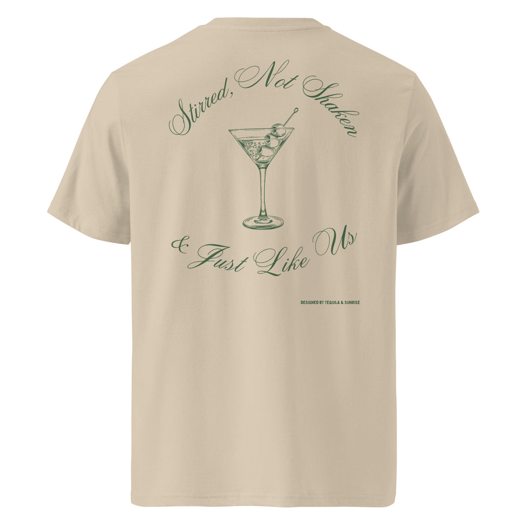 Just Like Us Organic T-shirt featuring a playful cocktail design on a beige background.